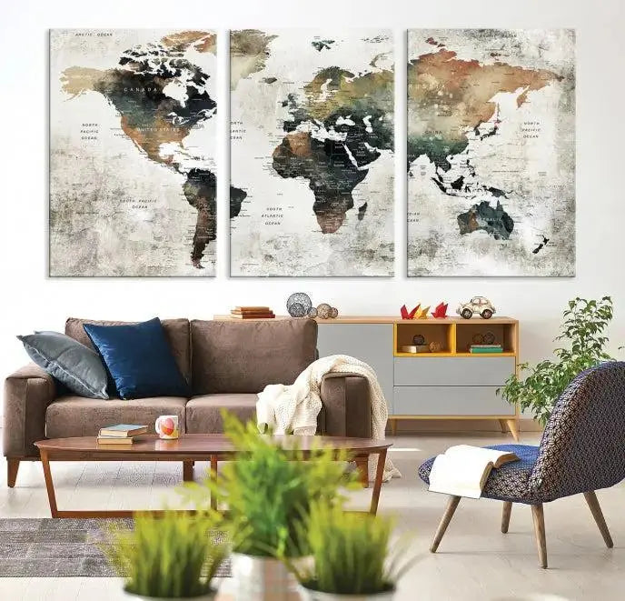 The dark wall is elegantly adorned with the Watercolor World Map Wall Art Canvas Print in a triptych style. Each canvas features a UV-protective coating and is ready to hang, seamlessly blending sophistication with practicality.