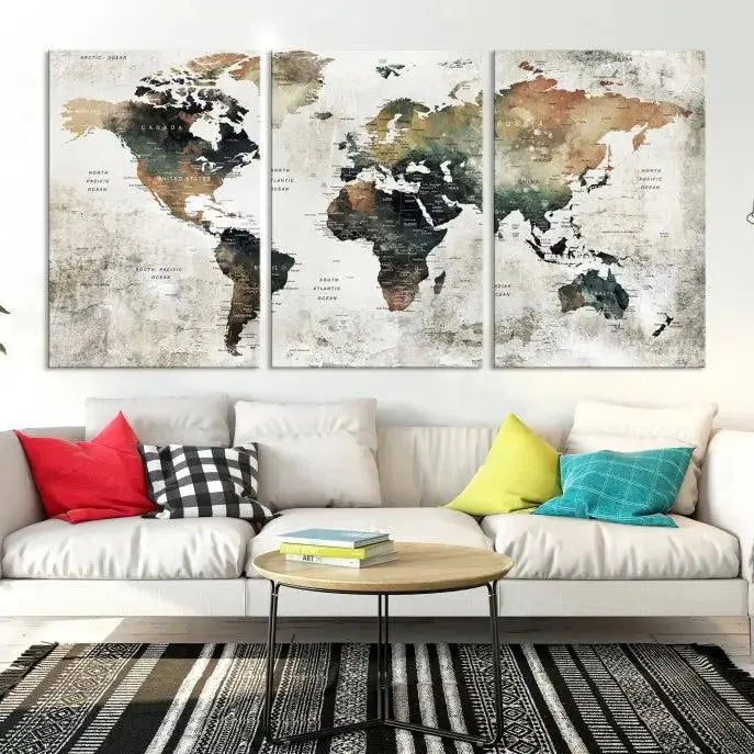 The dark wall is elegantly adorned with the Watercolor World Map Wall Art Canvas Print in a triptych style. Each canvas features a UV-protective coating and is ready to hang, seamlessly blending sophistication with practicality.