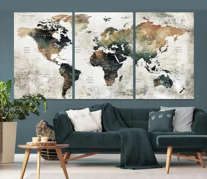 The dark wall is elegantly adorned with the Watercolor World Map Wall Art Canvas Print in a triptych style. Each canvas features a UV-protective coating and is ready to hang, seamlessly blending sophistication with practicality.