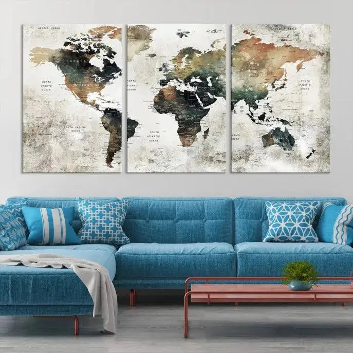 The dark wall is elegantly adorned with the Watercolor World Map Wall Art Canvas Print in a triptych style. Each canvas features a UV-protective coating and is ready to hang, seamlessly blending sophistication with practicality.