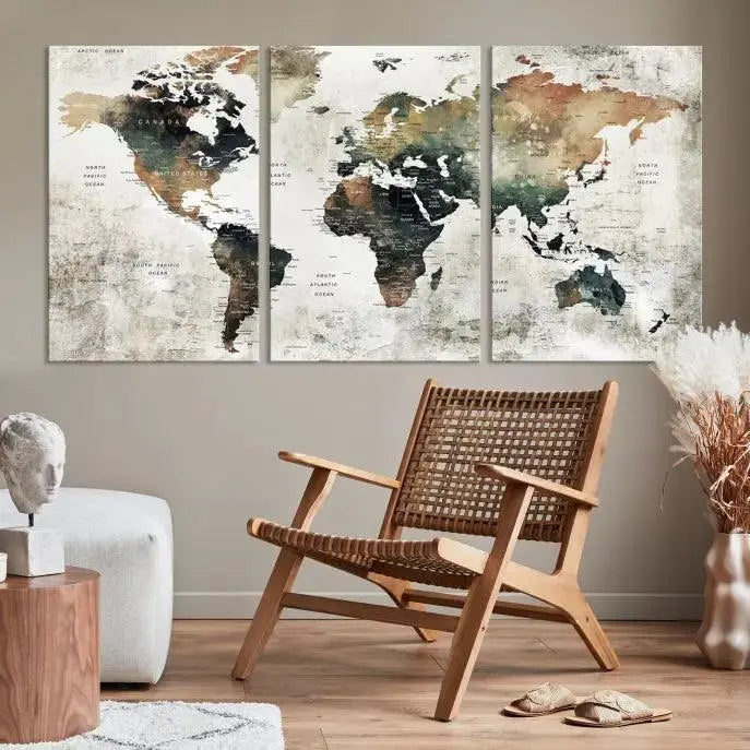 The dark wall is elegantly adorned with the Watercolor World Map Wall Art Canvas Print in a triptych style. Each canvas features a UV-protective coating and is ready to hang, seamlessly blending sophistication with practicality.