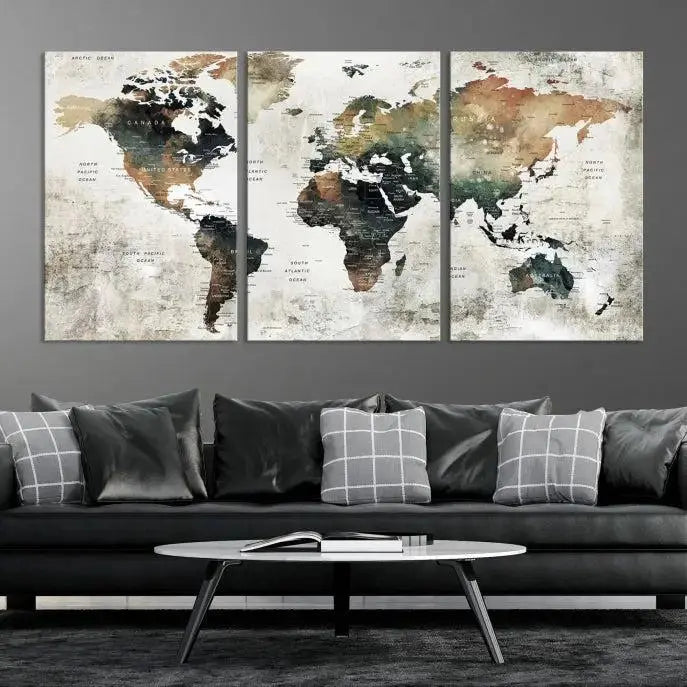 The dark wall is elegantly adorned with the Watercolor World Map Wall Art Canvas Print in a triptych style. Each canvas features a UV-protective coating and is ready to hang, seamlessly blending sophistication with practicality.