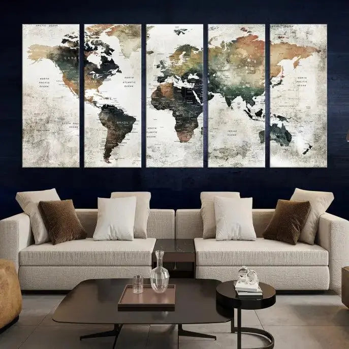 The dark wall is elegantly adorned with the Watercolor World Map Wall Art Canvas Print in a triptych style. Each canvas features a UV-protective coating and is ready to hang, seamlessly blending sophistication with practicality.