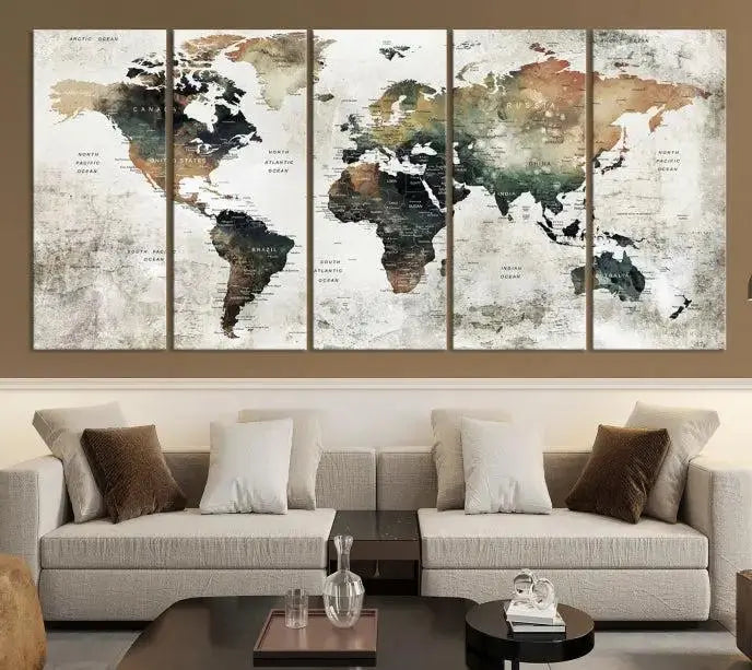 The dark wall is elegantly adorned with the Watercolor World Map Wall Art Canvas Print in a triptych style. Each canvas features a UV-protective coating and is ready to hang, seamlessly blending sophistication with practicality.