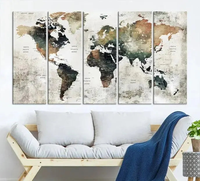 The dark wall is elegantly adorned with the Watercolor World Map Wall Art Canvas Print in a triptych style. Each canvas features a UV-protective coating and is ready to hang, seamlessly blending sophistication with practicality.