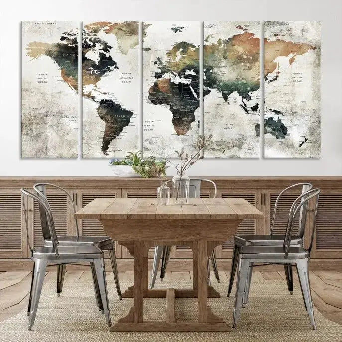 The dark wall is elegantly adorned with the Watercolor World Map Wall Art Canvas Print in a triptych style. Each canvas features a UV-protective coating and is ready to hang, seamlessly blending sophistication with practicality.