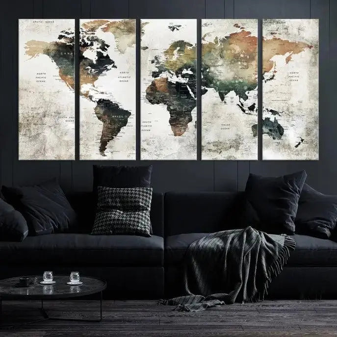 The dark wall is elegantly adorned with the Watercolor World Map Wall Art Canvas Print in a triptych style. Each canvas features a UV-protective coating and is ready to hang, seamlessly blending sophistication with practicality.