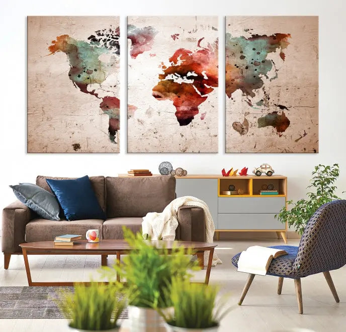 The living room features the Watercolor World Map Wall Art Canvas Print on gallery-wrapped, museum-quality canvases. Its UV-protective coating ensures the artwork's lasting vibrancy.