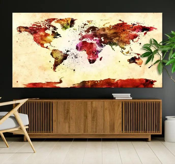 The "Watercolor World Map Wall Art Canvas Print" features three panels in vibrant colors on a gallery-wrapped, museum-quality canvas with UV-protective coating, decorating the wall.