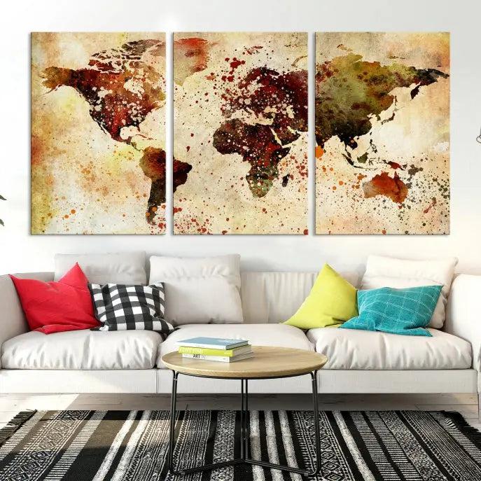 The "Watercolor World Map Wall Art Canvas Print" features three panels and is printed on museum-quality canvas with a UV-protective coating. It hangs elegantly in the modern living room.