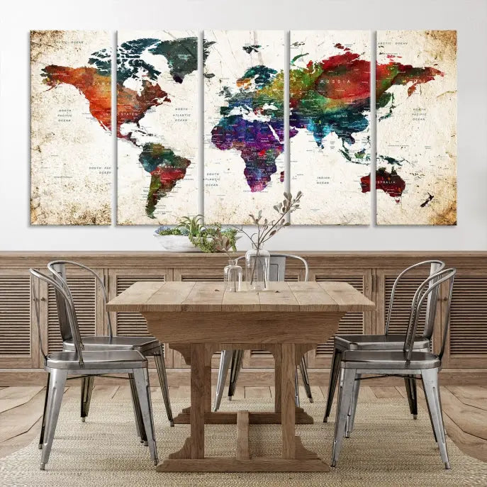 A three-panel Watercolor World Map Wall Art Canvas Print, crafted on museum-quality canvas with a UV-protective coating, is displayed against the dark wall. Ready to hang, it brings vibrant colors and sophistication to your space.