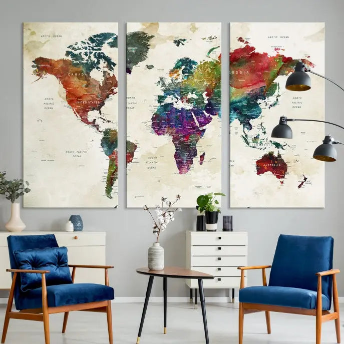 The room showcases the Watercolor World Map Wall Art Canvas Print, professionally framed on museum-quality pollycotton canvas.