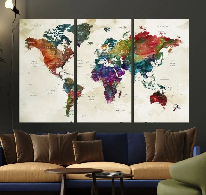 The room showcases the Watercolor World Map Wall Art Canvas Print, professionally framed on museum-quality pollycotton canvas.