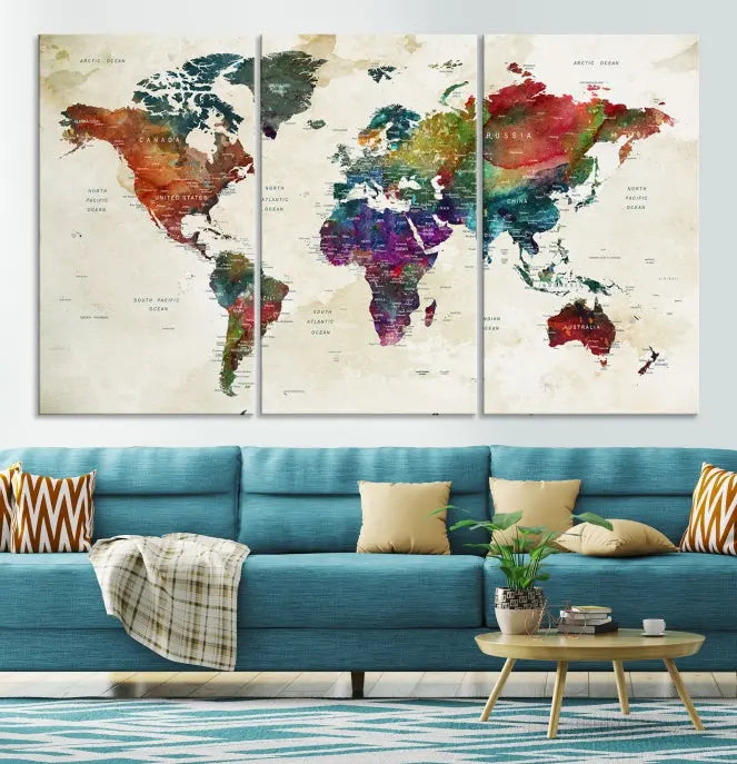 The room showcases the Watercolor World Map Wall Art Canvas Print, professionally framed on museum-quality pollycotton canvas.