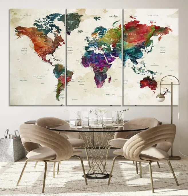 The room showcases the Watercolor World Map Wall Art Canvas Print, professionally framed on museum-quality pollycotton canvas.