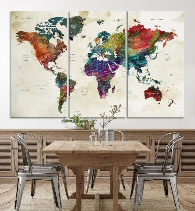 The room showcases the Watercolor World Map Wall Art Canvas Print, professionally framed on museum-quality pollycotton canvas.