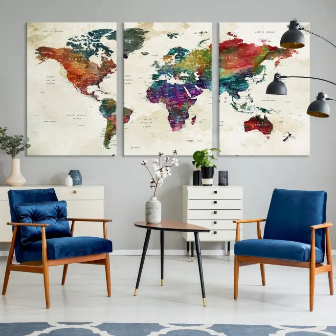 The room showcases the Watercolor World Map Wall Art Canvas Print, professionally framed on museum-quality pollycotton canvas.