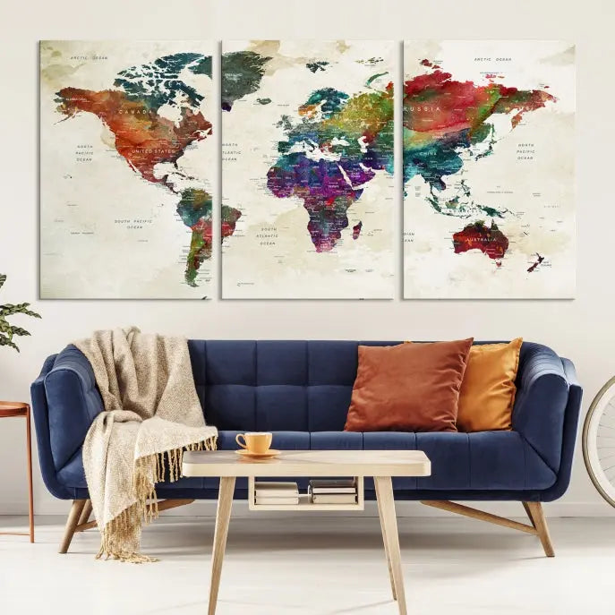 The room showcases the Watercolor World Map Wall Art Canvas Print, professionally framed on museum-quality pollycotton canvas.