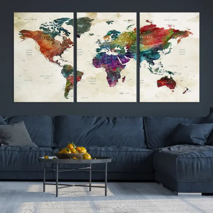 The room showcases the Watercolor World Map Wall Art Canvas Print, professionally framed on museum-quality pollycotton canvas.