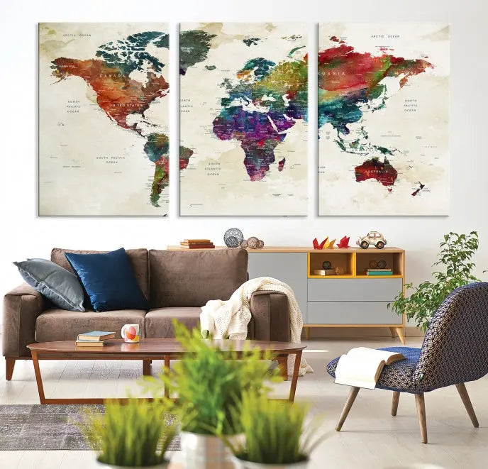 The room showcases the Watercolor World Map Wall Art Canvas Print, professionally framed on museum-quality pollycotton canvas.