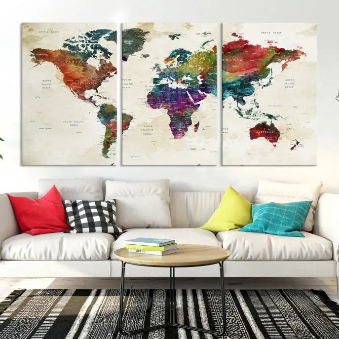 The room showcases the Watercolor World Map Wall Art Canvas Print, professionally framed on museum-quality pollycotton canvas.