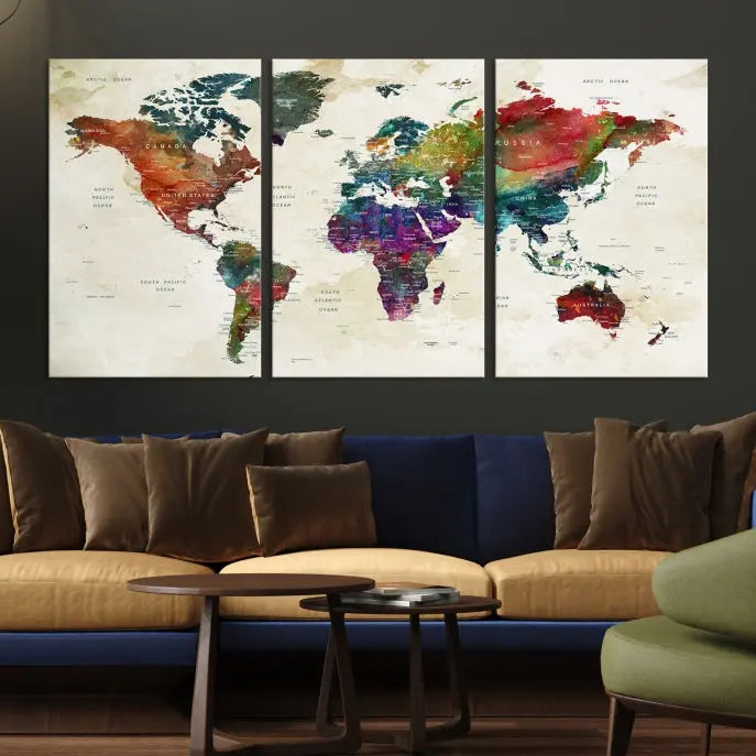 The room showcases the Watercolor World Map Wall Art Canvas Print, professionally framed on museum-quality pollycotton canvas.