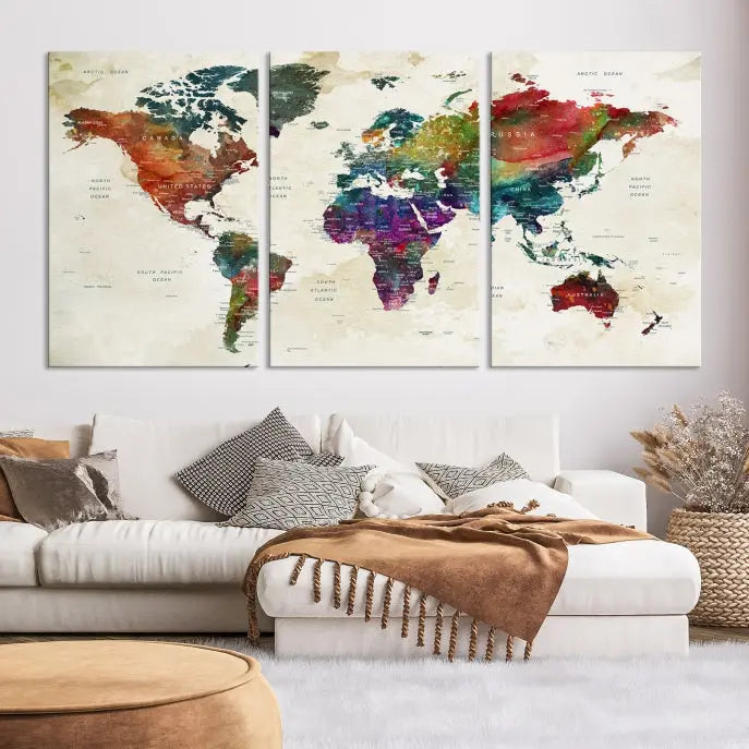 The room showcases the Watercolor World Map Wall Art Canvas Print, professionally framed on museum-quality pollycotton canvas.