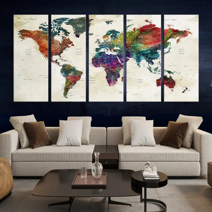 The room showcases the Watercolor World Map Wall Art Canvas Print, professionally framed on museum-quality pollycotton canvas.