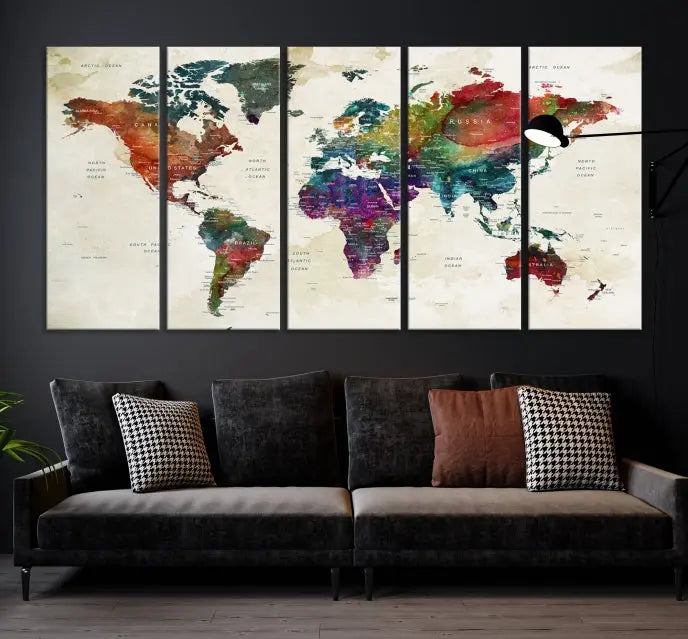 The room showcases the Watercolor World Map Wall Art Canvas Print, professionally framed on museum-quality pollycotton canvas.