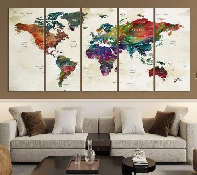 The room showcases the Watercolor World Map Wall Art Canvas Print, professionally framed on museum-quality pollycotton canvas.