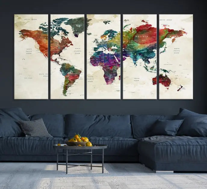 The room showcases the Watercolor World Map Wall Art Canvas Print, professionally framed on museum-quality pollycotton canvas.