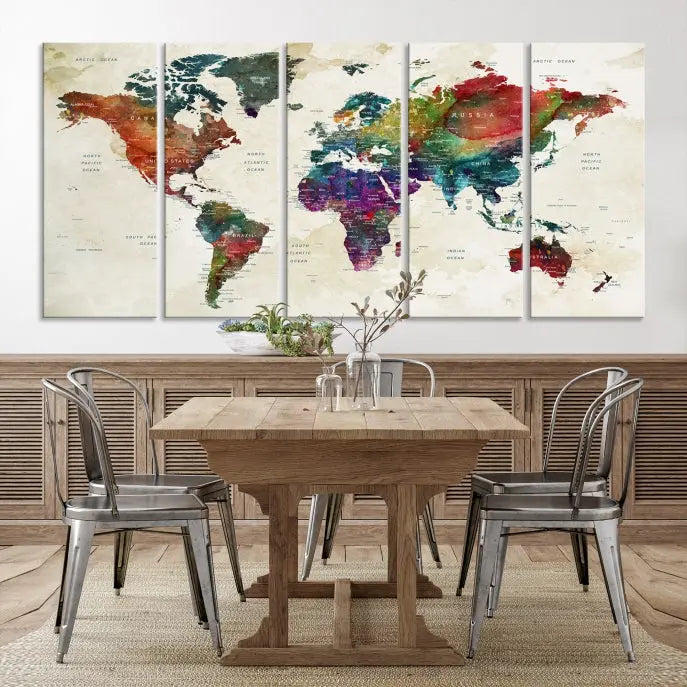 The room showcases the Watercolor World Map Wall Art Canvas Print, professionally framed on museum-quality pollycotton canvas.