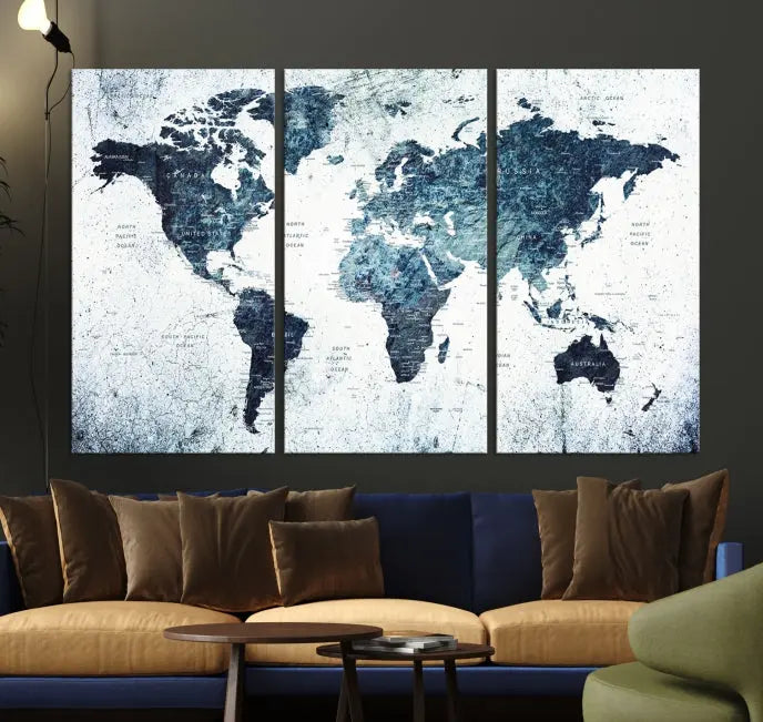 The "Watercolor World Map Wall Art Canvas Print," treated with a UV-protective coating to maintain its vivid colors, is displayed in a modern living room.