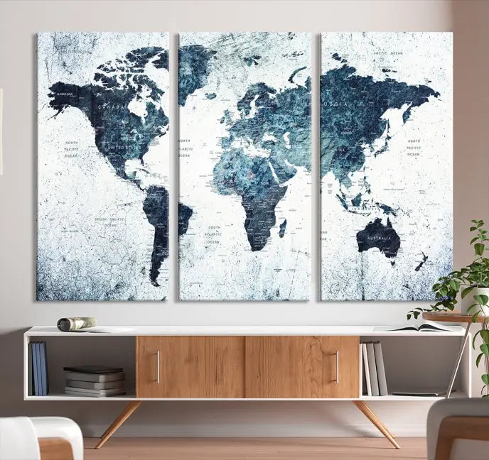 The "Watercolor World Map Wall Art Canvas Print," treated with a UV-protective coating to maintain its vivid colors, is displayed in a modern living room.