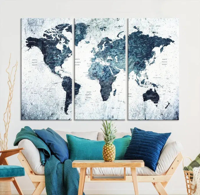 The "Watercolor World Map Wall Art Canvas Print," treated with a UV-protective coating to maintain its vivid colors, is displayed in a modern living room.