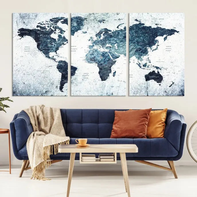 The "Watercolor World Map Wall Art Canvas Print," treated with a UV-protective coating to maintain its vivid colors, is displayed in a modern living room.