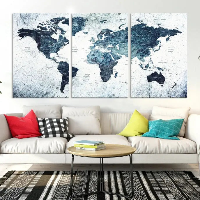 The "Watercolor World Map Wall Art Canvas Print," treated with a UV-protective coating to maintain its vivid colors, is displayed in a modern living room.