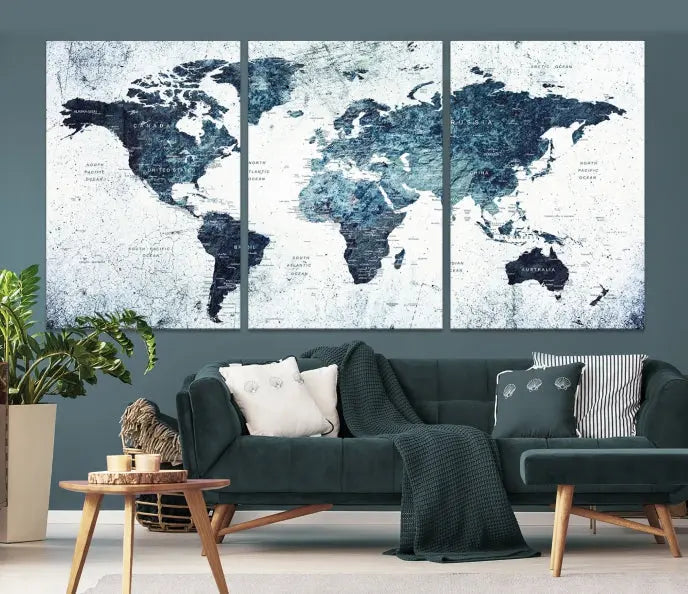 The "Watercolor World Map Wall Art Canvas Print," treated with a UV-protective coating to maintain its vivid colors, is displayed in a modern living room.