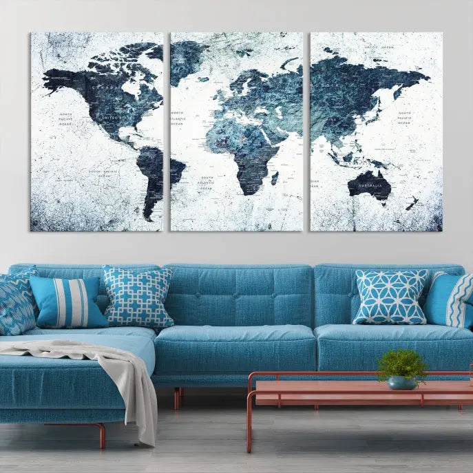 The "Watercolor World Map Wall Art Canvas Print," treated with a UV-protective coating to maintain its vivid colors, is displayed in a modern living room.