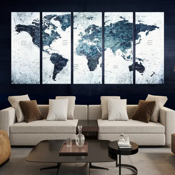 The "Watercolor World Map Wall Art Canvas Print," treated with a UV-protective coating to maintain its vivid colors, is displayed in a modern living room.