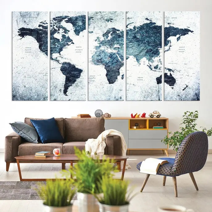 The "Watercolor World Map Wall Art Canvas Print," treated with a UV-protective coating to maintain its vivid colors, is displayed in a modern living room.