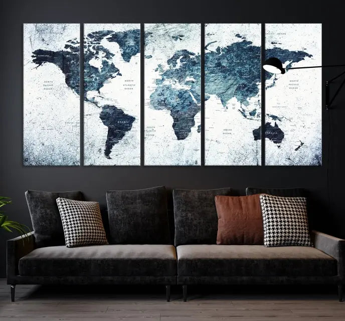 The "Watercolor World Map Wall Art Canvas Print," treated with a UV-protective coating to maintain its vivid colors, is displayed in a modern living room.