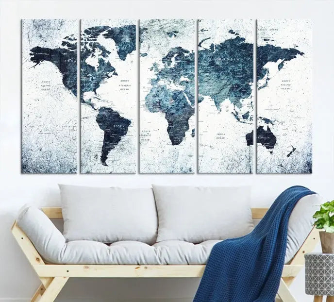 The "Watercolor World Map Wall Art Canvas Print," treated with a UV-protective coating to maintain its vivid colors, is displayed in a modern living room.