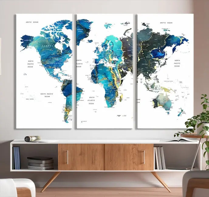 A hand-assembled, three-panel Watercolor World Map Wall Art Canvas Print in shades of blue and green adds a ready-to-hang touch of elegance to the living room.