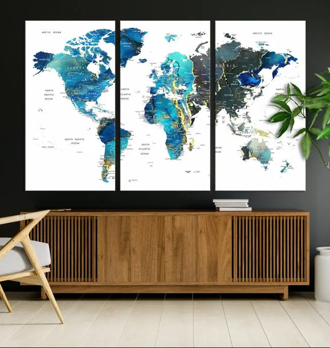 A hand-assembled, three-panel Watercolor World Map Wall Art Canvas Print in shades of blue and green adds a ready-to-hang touch of elegance to the living room.