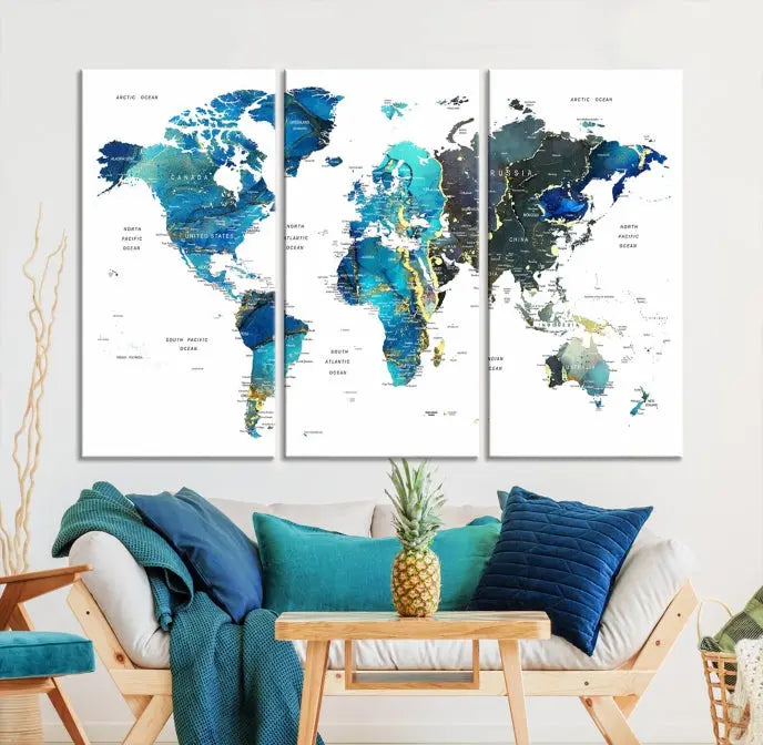 A hand-assembled, three-panel Watercolor World Map Wall Art Canvas Print in shades of blue and green adds a ready-to-hang touch of elegance to the living room.