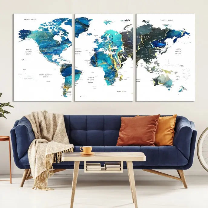 A hand-assembled, three-panel Watercolor World Map Wall Art Canvas Print in shades of blue and green adds a ready-to-hang touch of elegance to the living room.