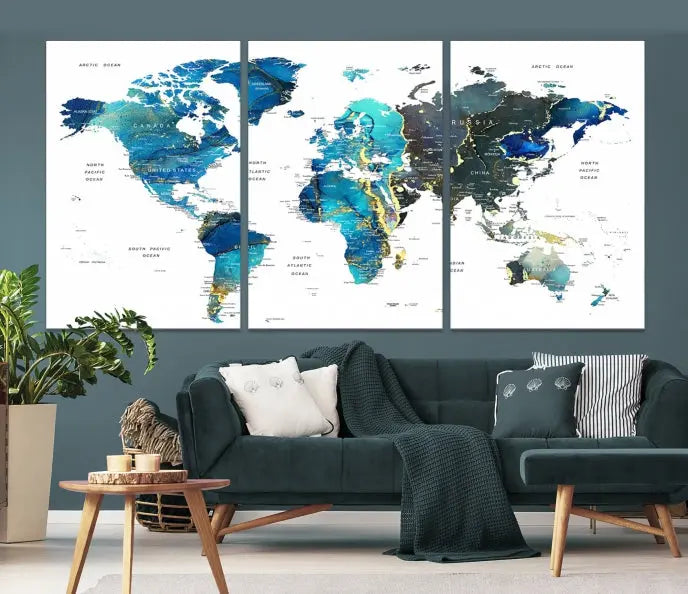 A hand-assembled, three-panel Watercolor World Map Wall Art Canvas Print in shades of blue and green adds a ready-to-hang touch of elegance to the living room.