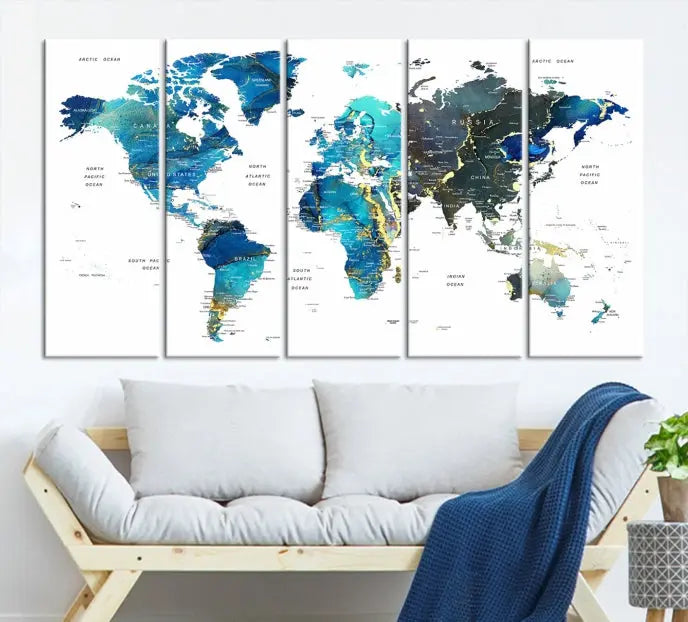 A hand-assembled, three-panel Watercolor World Map Wall Art Canvas Print in shades of blue and green adds a ready-to-hang touch of elegance to the living room.