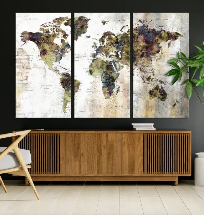 The Watercolor World Map Wall Art Canvas Print adorns the dark wall, creating a striking focal point.